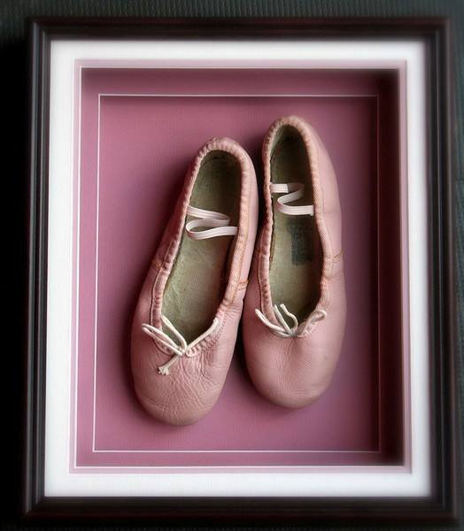 pink ballet shoes on pink background in a shadow box frame