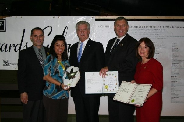 avelino and frecia correia receiving  2009 quinte business achievement award from mayor john williams, mp daryl kramp and mpp leona dombrowsky